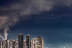 Streams of smoke could be seen coming up from the buildings below, which looked to be &#039;welcoming the comet&#039;, said recreational photographer James Gan.