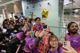 Singapore kitefoiler Maximilian Maeder taking a wefie with supporters who had turned up to welcome him at the airport on Aug 13.