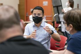 Minister for National Development Desmond Lee discussing with participants in a public engagement session on rejuvenating heartland shops.