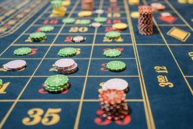 The scheme sold packages promising lucrative returns from the winnings of professional gamblers playing baccarat at casinos.