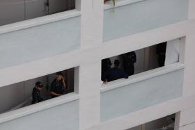 Police were seen outside an eight floor unit  at block 107 Potong Pasir Avenue 1 on Aug 28.