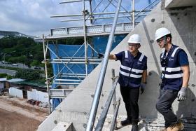 The Ministry of Manpower&#039;s Occupational Safety and Health Division officers conducting a safety inspection in Ang Mo Kio Avenue 5 on Nov 7.