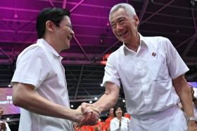 Senior Minister Lee Hsien Loong (right) with Prime Minister Lawrence Wong after SM Lee delivered his speech at the PAP conference at the Singapore Expo on Nov 24.