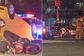 A yellow car that had overturned and two damaged motorcycles were seen in the aftermath of the accident.