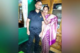 Mr Salim Hossain, who died in a workplace accident in Lentor Avenue on Sept 17, with his wife.