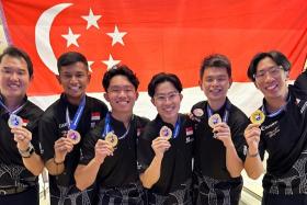 (From left) Jaris Goh, Nu’man Syahmi, Mike Ong, Joel Tan, Darren Ong and Jomond Chia with their gold medals at the Asian Tenpin Bowling Championships.