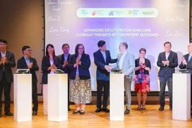 The Memorandum of understanding signing ceremony on advancing acne treatment research being signed at the National Skin Centre on Nov 22.