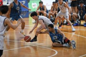 A Tungsan player seen on the ground during a National Basketball League Division One match at the Singapore Basketball Centre on Aug 18. There have been complaints of the court floors being slippery.