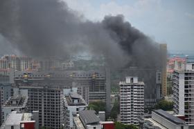 Thick plumes of smoke are billowing from Golden Mile Tower on Aug 31.