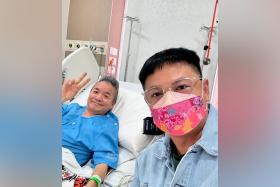 Dennis Chew (right) visited Marcus Chin in hospital on Oct 8.